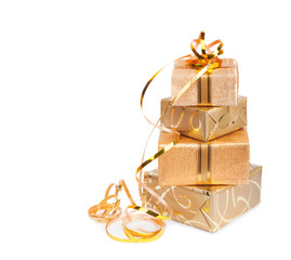 Beautiful  Gift box in gold wrapping paper isolated on a white b