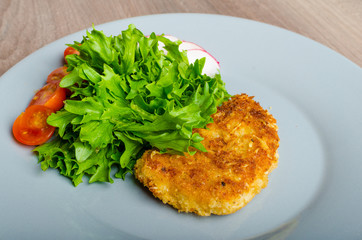 Breaded pork chops in Parmesan cheese