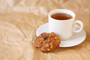 light breakfast: a cup of tea and diet oatmeal cookies horizonta