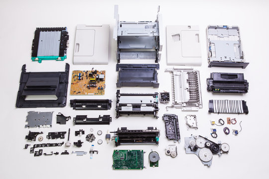 Disassembled printer on a white background