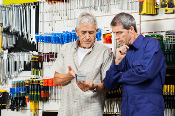 Customer And Vender Discussing Over Packed Tool