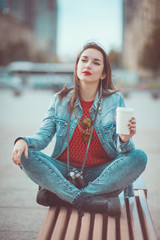 Hipster girl drinking coffee