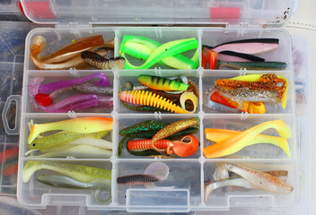 fisherman's tackle box with lures and gear for fishing © joppo