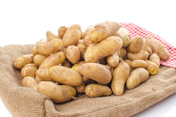 New rattes potatoes on burlap