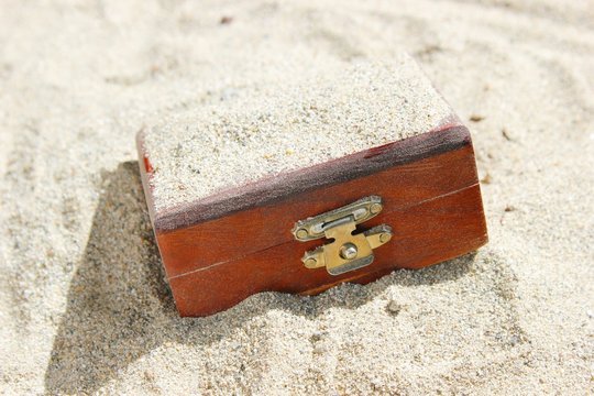 Treasure Chest Buried in Sand