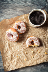 Hot coffee and donuts on paper