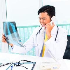 Asian doctor diagnosis radiograph in practise