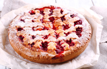 Tasty cake with berries on table close-up
