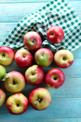 Juicy apples on wooden table, close-up