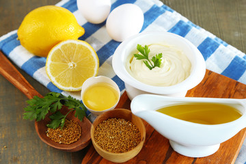 Mayonnaise ingredients on wooden background