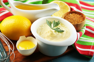 Mayonnaise ingredients on wooden background