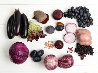 Fresh organic vegetables on wooden table, close up