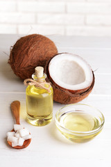 Coconut oil on table on light background