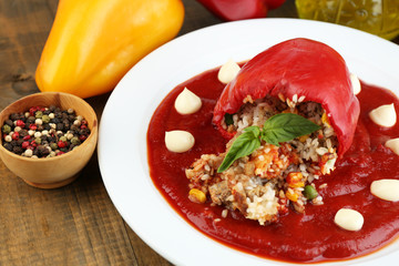 Prepared stuffed pepper with tomato sauce