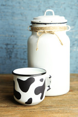 Retro still life with tasty rustic milk, on wooden table