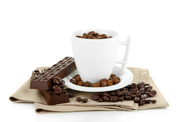 Cup with coffee beans and dark chocolate glaze, isolated