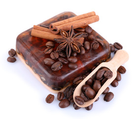 Organic soap with coffee beans and spices, isolated on white