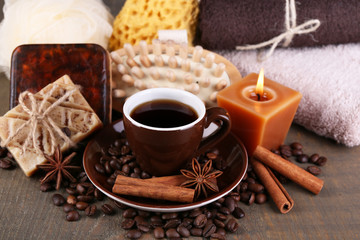 Obraz na płótnie Canvas Cup with coffee drink, soap with coffee beans and spices,