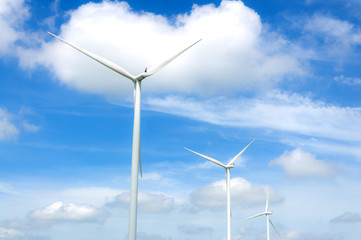 Wind turbine on the  blue clouded sky