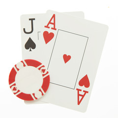 Blackjack hand with casino chip