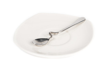 a spoon on dish in white background