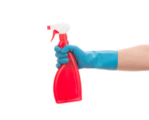 Hand in gloves holds spray bottle.