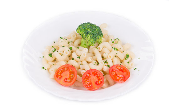 Pasta cavatappi with vegetables on white plate.