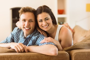 Happy young couple relaxing on the couch