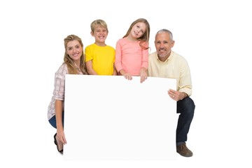 Happy family showing white card