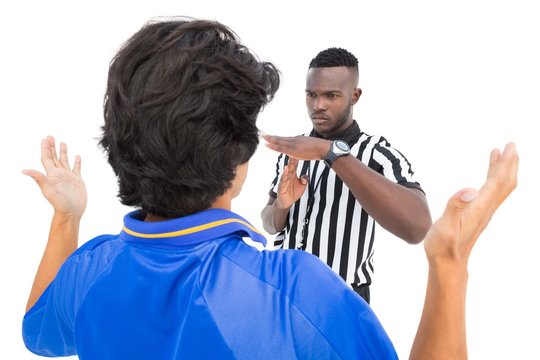 Serious Referee Showing Time Out Sign To Player