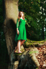 Portrait of romantic woman at fairy forest