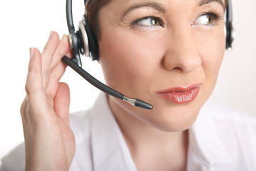 Young woman with headset has problems to understand the caller