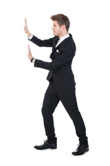 Businessman Pushing Invisible Wall