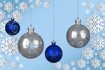 Composite image of blue and silver christmas baubles