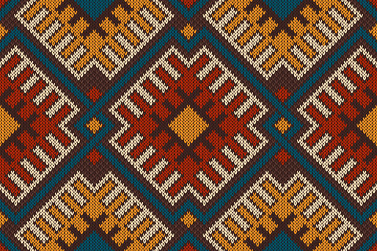 Traditional Tribal Aztec seamless pattern on the wool knitted te