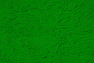 The texture of green walls painted large erratic strokes of pain