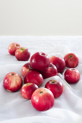 Shine bright  apples on a white tablecloth