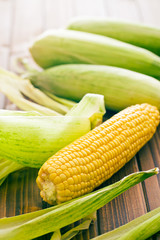 sweet corn on wooden table