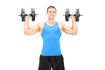 Naklejka na ściany i meble Strong male bodybuilder exercising with barbells