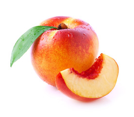 Ripe peach with leaf.