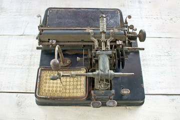 Antique  typewriter on white wooden background