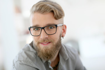Portrait of stylish young man with beard