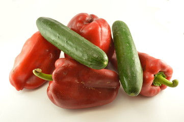 Cucumbers and peppers isolate on white