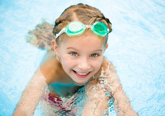 Little girl in swimming pool