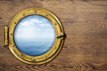 ship or boat porthole on wooden wall