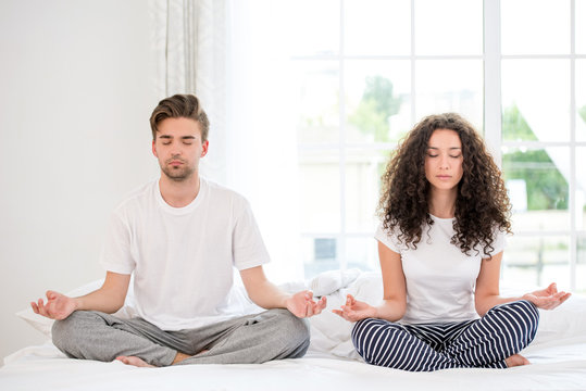 Couple meditating in the morning