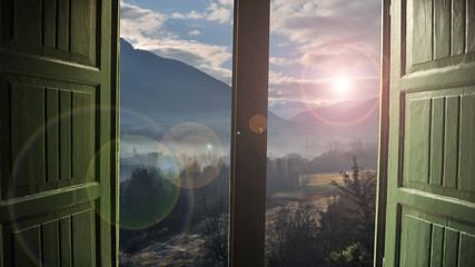 Open window with countryside view and sunlight streaming in