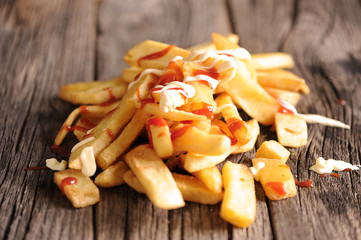 French Fries Covered in Tomato Ketchup and mayonaise