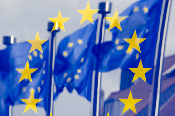 Reflection of UE flags in a panel on the wall of the European Commission © mbruxelle