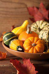 decorative pumpkins and autumn leaves for halloween
